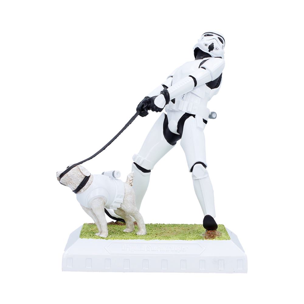 Stormtrooper figure with a dog on a leash on a white background